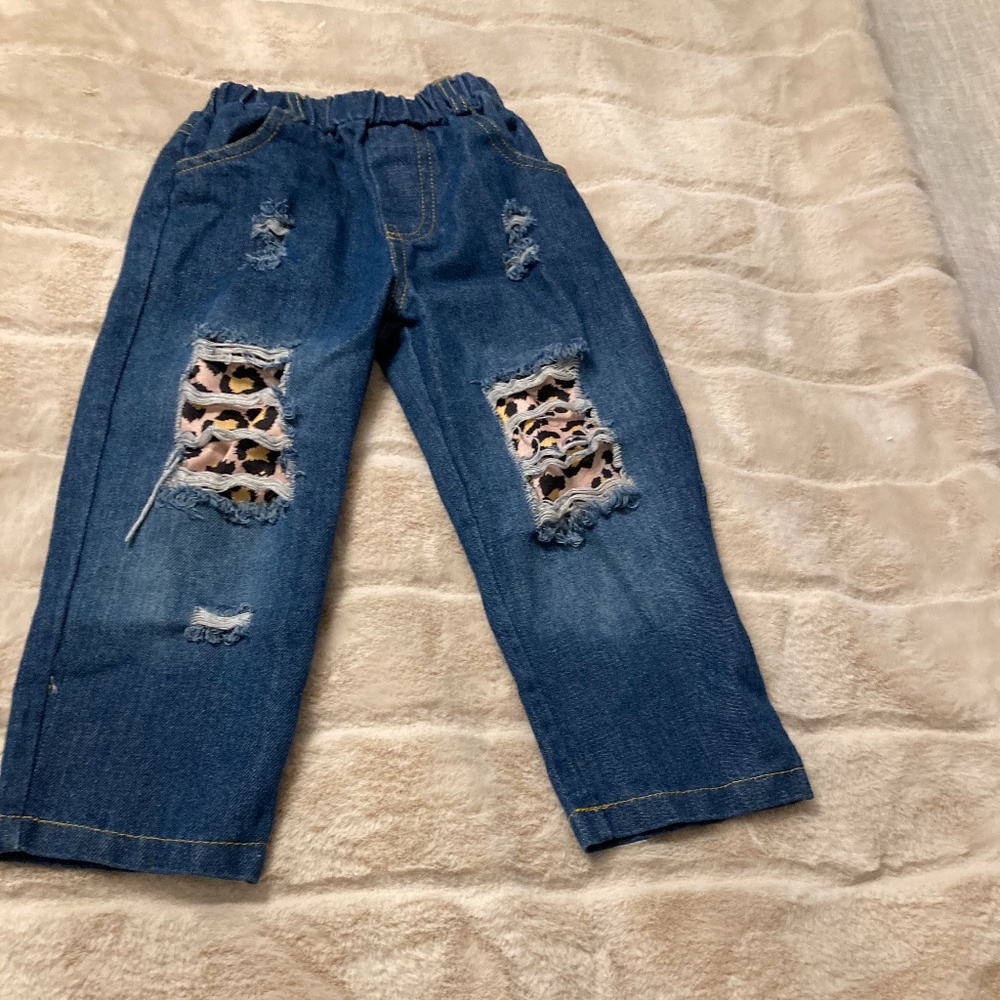 Distressed cheetah print denim